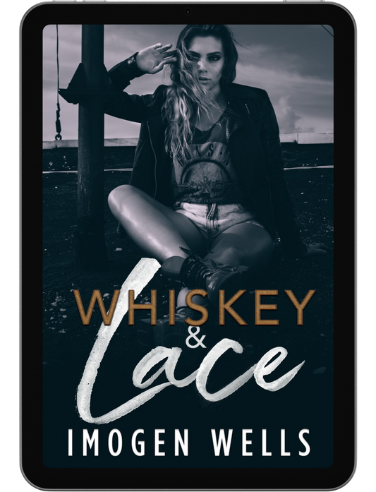 Book cover for Whiskey & Lace by Imogen Wells displayed on a tablet/e-reader.
